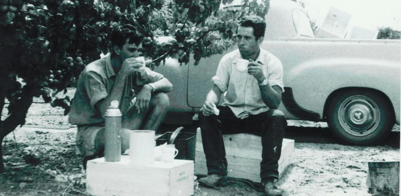 Workers taking a smoko break beside the ute